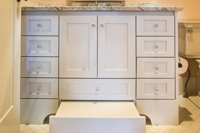 Example of a kids' bathroom design in Atlanta with shaker cabinets, white cabinets, an undermount sink and granite countertops