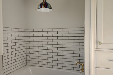 Inspiration for a small contemporary master white tile and subway tile marble floor and gray floor bathroom remodel in Salt Lake City with flat-panel cabinets, a vessel sink, quartz countertops and a hinged shower door