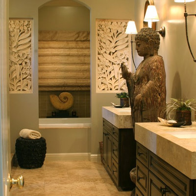 Bathroom - zen bathroom idea in San Francisco with limestone countertops and an undermount sink