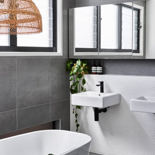 Photo of a small contemporary master bathroom in Sunshine Coast with a freestanding tub, white tile, mosaic tile, ceramic floors and grey floor.