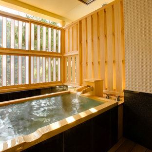 Inspiration for an asian bathroom in Tokyo with a japanese tub.