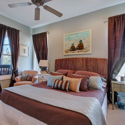 Example of a beach style bedroom design in Miami with gray walls
