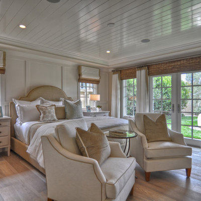 Bedroom - coastal light wood floor bedroom idea in Los Angeles with white walls
