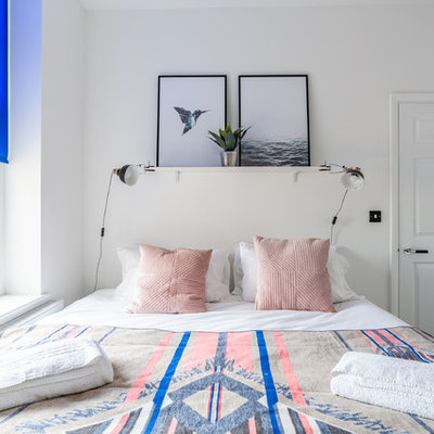 Inspiration for a contemporary bedroom remodel in Los Angeles with white walls