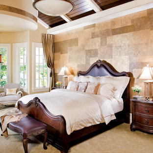 Bedroom - huge mediterranean master carpeted bedroom idea in Indianapolis with beige walls