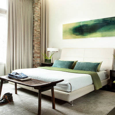 Inspiration for a contemporary dark wood floor bedroom remodel in Atlanta with white walls