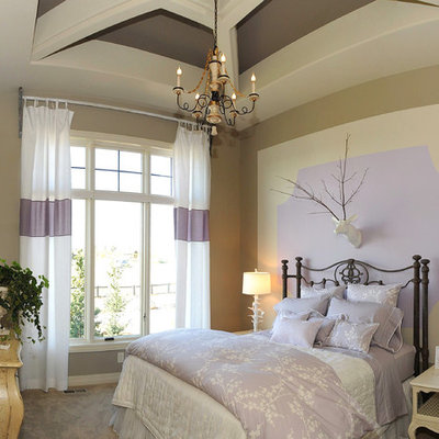 Example of a mid-sized classic guest carpeted and beige floor bedroom design in Omaha with multicolored walls