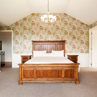 Traditional master bedroom in Melbourne with multi-coloured walls, carpet and brown floor.