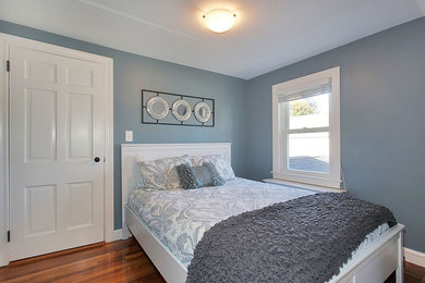 Inspiration for a contemporary bedroom remodel in Boston with blue walls