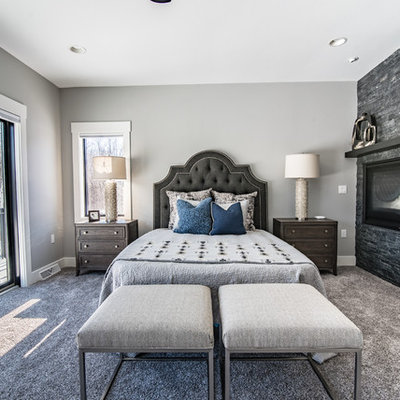 Bedroom - transitional guest carpeted and gray floor bedroom idea in Other with gray walls