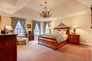 Design ideas for a medium sized classic master bedroom in New York with beige walls and carpet.