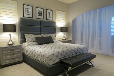 Bedroom - large modern master carpeted and beige floor bedroom idea in Phoenix with gray walls