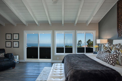 Inspiration for a traditional master bedroom in Orange County with grey walls and dark hardwood flooring.