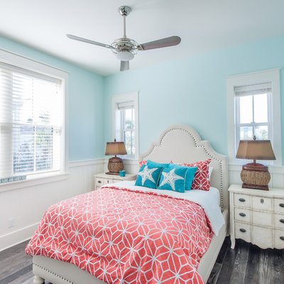 Bedroom - tropical gray floor bedroom idea in Miami with blue walls