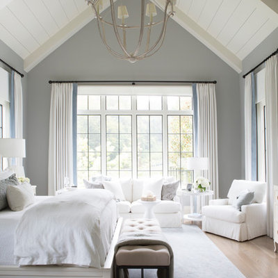 Inspiration for a coastal light wood floor and brown floor bedroom remodel in Nashville with gray walls