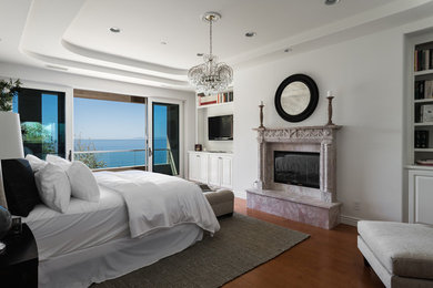 Large master bedroom photo in Orange County with white walls