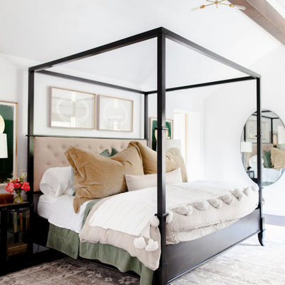 Example of a transitional dark wood floor and brown floor bedroom design in Sacramento with white walls