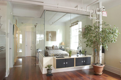 Bedroom - mid-sized transitional guest medium tone wood floor and brown floor bedroom idea in New York with white walls and no fireplace