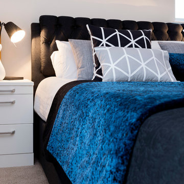A Monochrome Bedroom With Fitted Furniture