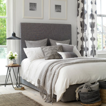 A smart and stylish bedroom with grey tones