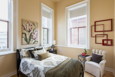 Bedroom - small victorian light wood floor bedroom idea in New York with beige walls and no fireplace