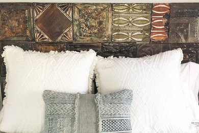 Example of a small eclectic guest terra-cotta tile bedroom design in Santa Barbara