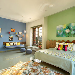 Foto de dormitorio asiático con paredes azules, suelo de cemento y suelo gris