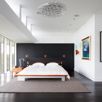 Bedroom - huge contemporary master dark wood floor bedroom idea in London with white walls and no fireplace