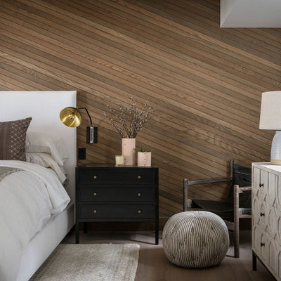 Inspiration for a farmhouse medium tone wood floor, brown floor and shiplap wall bedroom remodel in Seattle with brown walls
