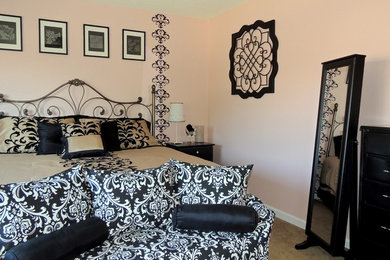 This is an example of a small traditional guest bedroom in Phoenix with pink walls and carpet.