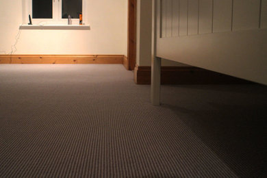 Mid-sized country master carpeted bedroom photo in West Midlands with white walls and no fireplace