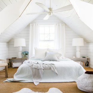 Beach style master carpeted and beige floor bedroom photo in Jacksonville with white walls