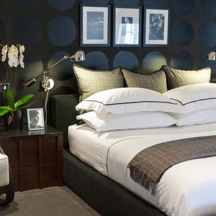 This is an example of a contemporary bedroom in London with black walls.