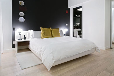 Bedroom - light wood floor bedroom idea in New York