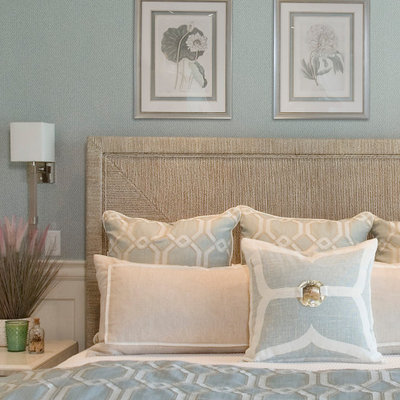 Inspiration for a large coastal master medium tone wood floor and brown floor bedroom remodel in Boston with blue walls