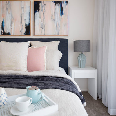 Example of a transitional master carpeted bedroom design in Gold Coast - Tweed with beige walls