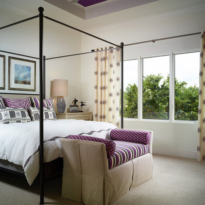 Bedroom - tropical carpeted bedroom idea in Miami with white walls