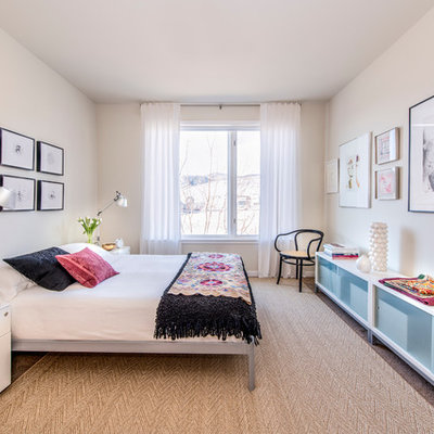 Example of a mid-sized trendy master light wood floor bedroom design in Los Angeles with white walls