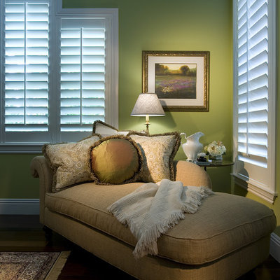 Example of a classic dark wood floor bedroom design in Miami with green walls