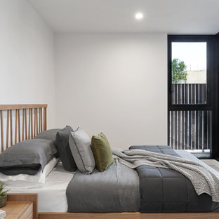 Inspiration for a contemporary guest bedroom in Melbourne with white walls and white floor.