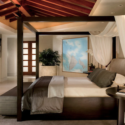 Inspiration for a contemporary bedroom remodel in Orange County with beige walls