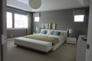 Example of a large classic master carpeted bedroom design in Vancouver with gray walls