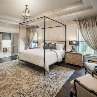 Example of a classic master dark wood floor and brown floor bedroom design in Atlanta with white walls