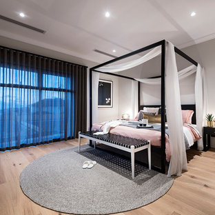 Design ideas for an asian master bedroom in Perth with grey walls, light hardwood floors and beige floor.