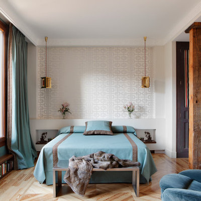 Bedroom - mid-sized traditional master medium tone wood floor bedroom idea in Madrid with white walls and no fireplace