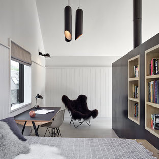 Inspiration for a medium sized contemporary guest bedroom in London with light hardwood flooring, grey floors and white walls.