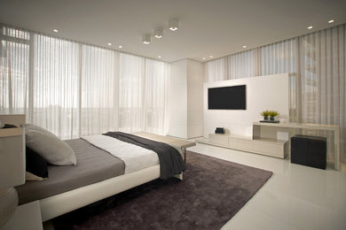 Example of a mid-sized trendy master ceramic tile bedroom design in Miami with beige walls