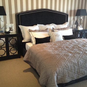 Balwyn North, mirrored bedside tables, black velvet bed-head, striped monogramme