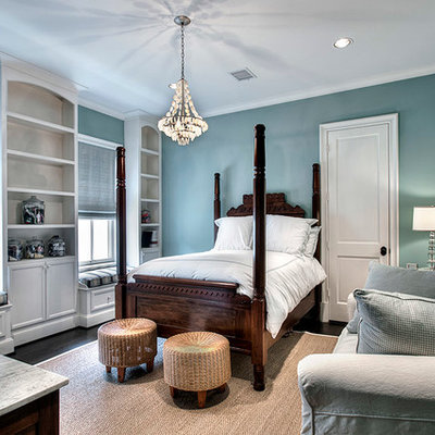 Elegant bedroom photo in Houston with blue walls