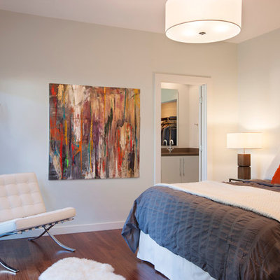 Example of a mid-sized minimalist master dark wood floor and brown floor bedroom design in Austin with white walls and no fireplace